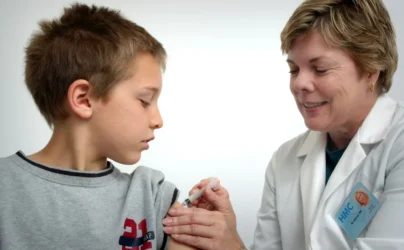 pediatrician near me accepting new patients - The nurse depicted in this 2006 photograph was in the process of administering an intramuscular vaccination in the left shoulder of a young boy. The nurse was pinching the overlying shoulder skin, in order to immobilize the injection site.