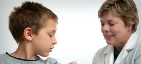 pediatrician near me accepting new patients - The nurse depicted in this 2006 photograph was in the process of administering an intramuscular vaccination in the left shoulder of a young boy. The nurse was pinching the overlying shoulder skin, in order to immobilize the injection site.