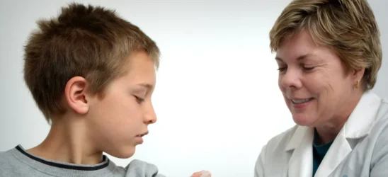 pediatrician near me accepting new patients - The nurse depicted in this 2006 photograph was in the process of administering an intramuscular vaccination in the left shoulder of a young boy. The nurse was pinching the overlying shoulder skin, in order to immobilize the injection site.